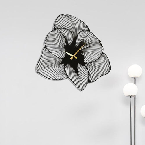 Modern metal wall clock featuring an